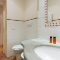 Main Bathroom with view into the Hallway